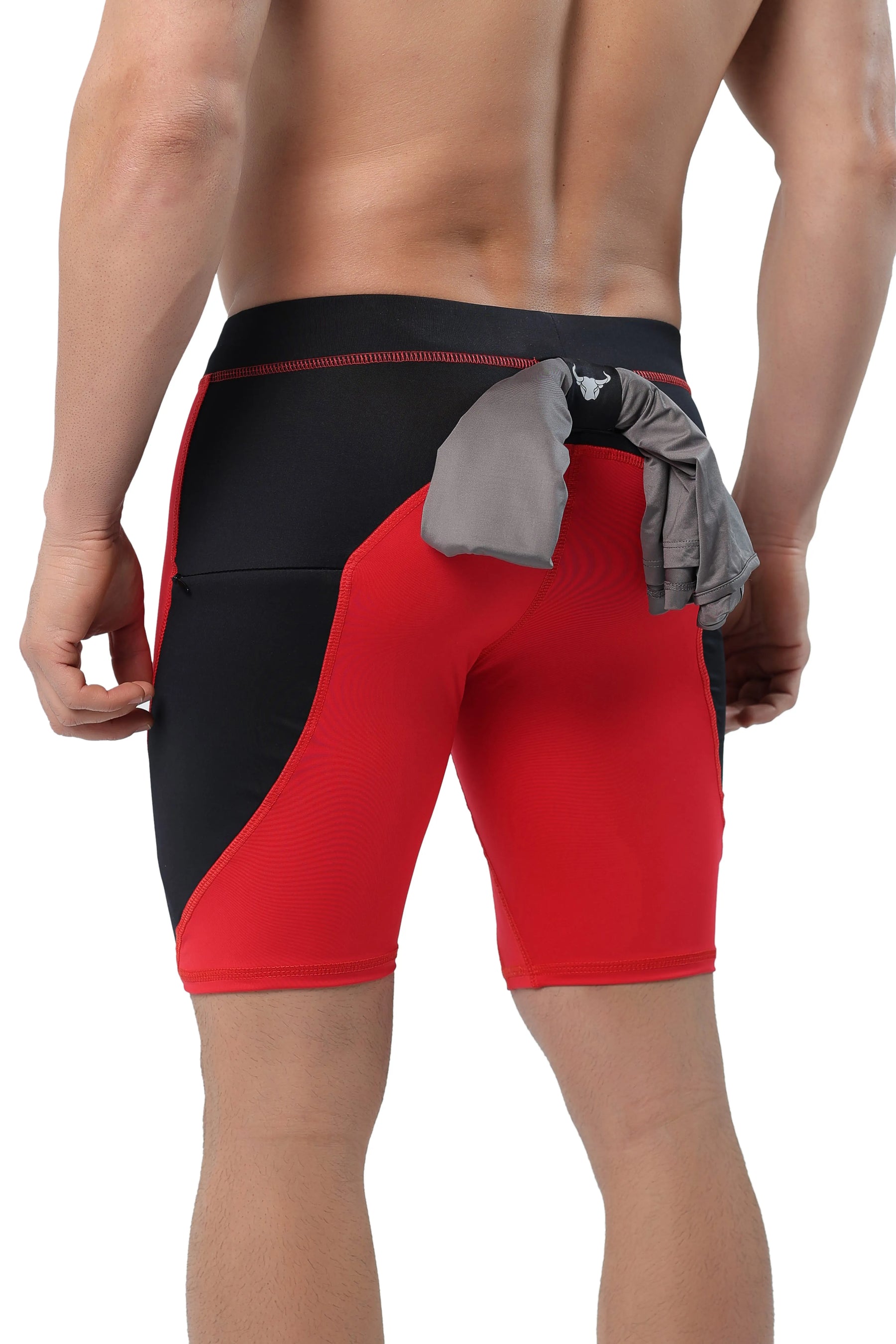 Men's red compression shorts with black panels and back towel loop feature.