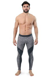 Black and grey compression leggings with abstract triangle pattern and supportive side panels.