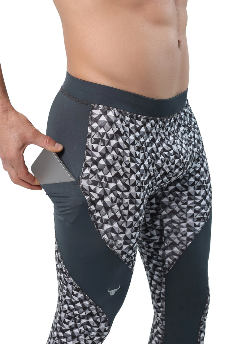 Men's black and grey tights with triangle print and back towel loop feature.