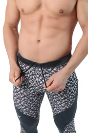 Men's black and grey camo leggings with bold geometric pattern and functional side pocket.