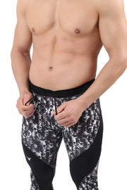 Men's skull leggings with black and white skull print and solid black contour panels.