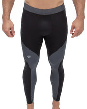 Men's gym leggings in a black and dark gray color block design with a contoured fit, ideal for training, running, or athletic performance.