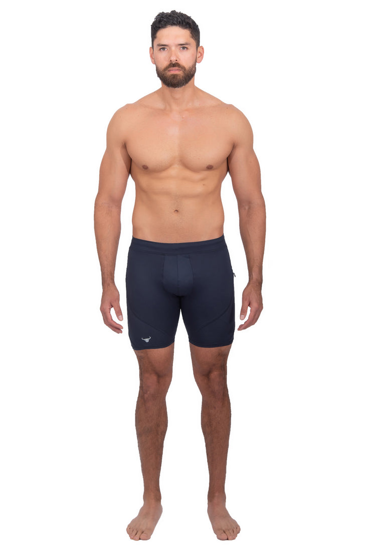 male model wearing solid navy compression shorts