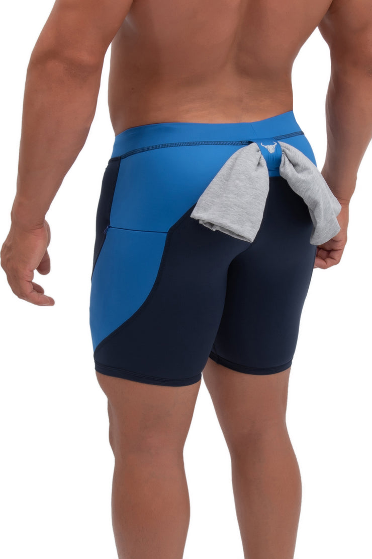 back side of navy blue men's half-side leggings with towel loop
