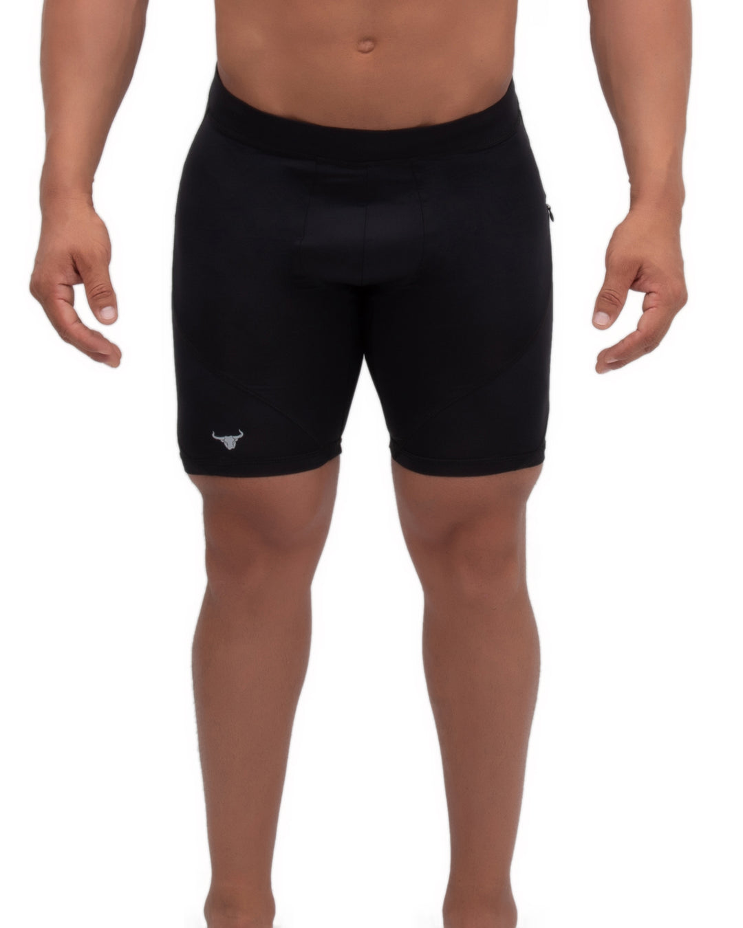 Black compression shorts worn by a muscular man standing against a white background.