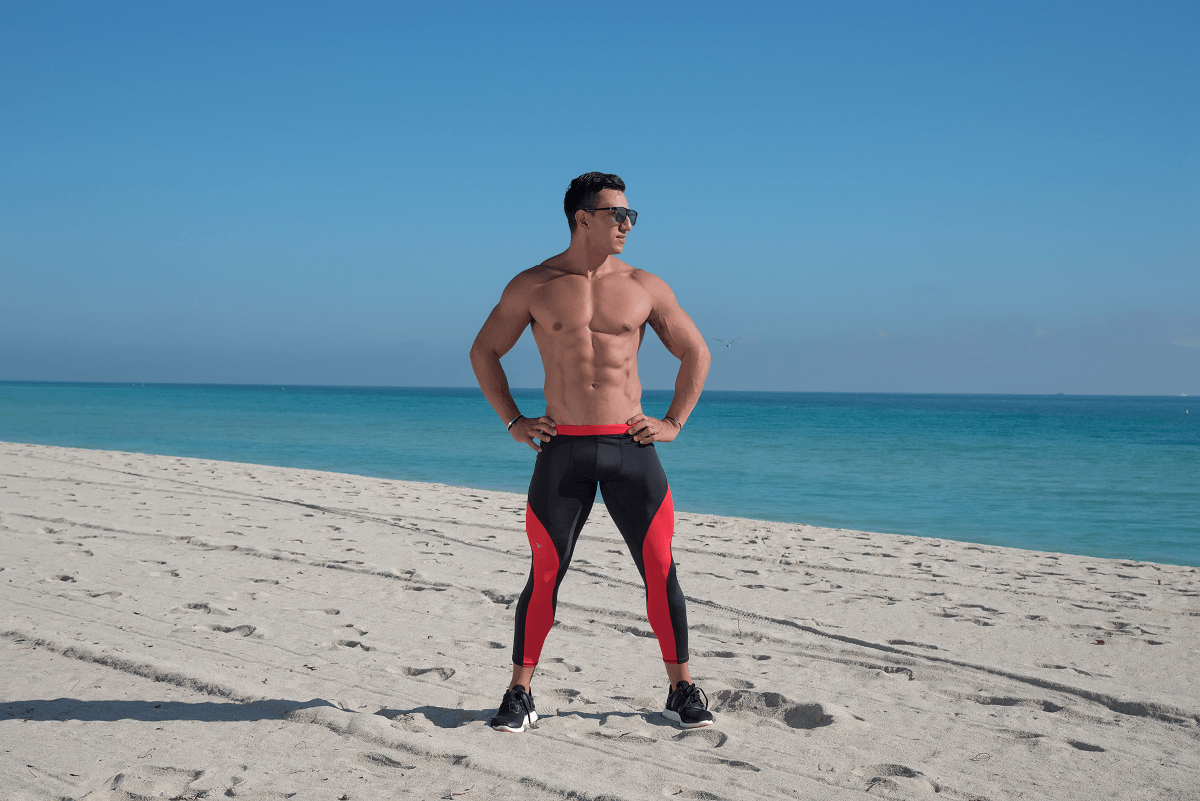 Man wearing Matador Meggings posing on the beach