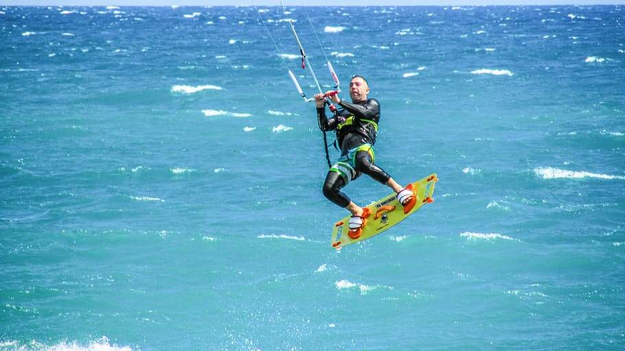 man surfing the water surface