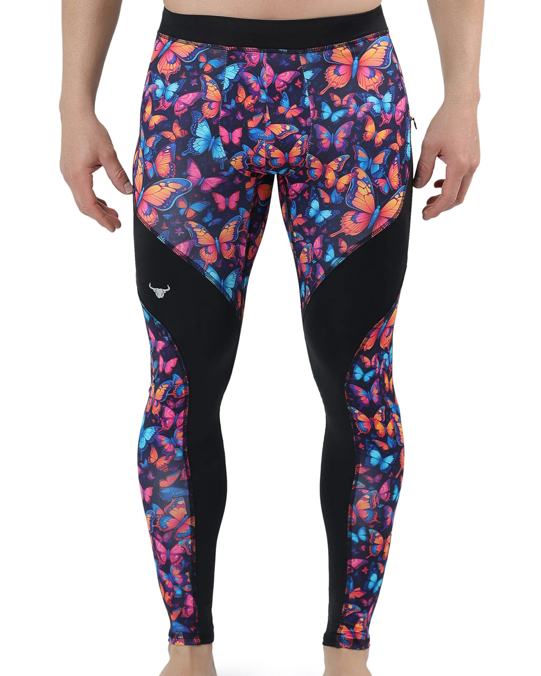 Men's leggings featuring a vivid butterfly print in shades of orange, pink, blue, and purple, set against a dark background with bold black contour panels.