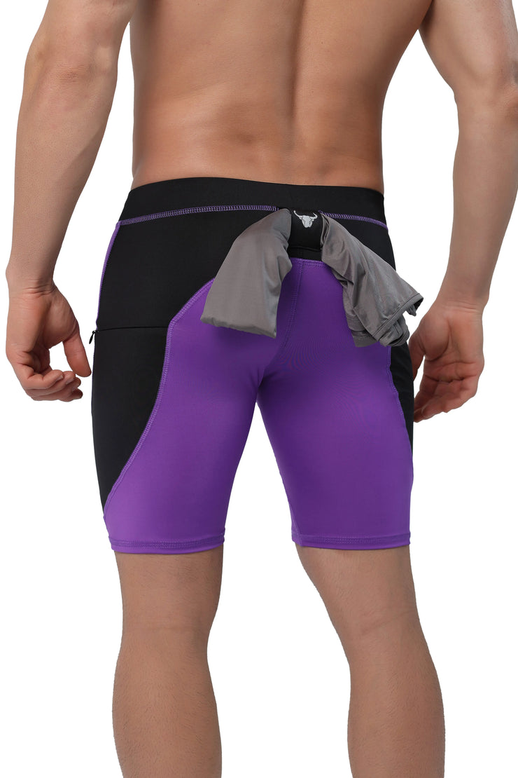 Men's purple compression shorts with black contrast and rear towel loop feature.
