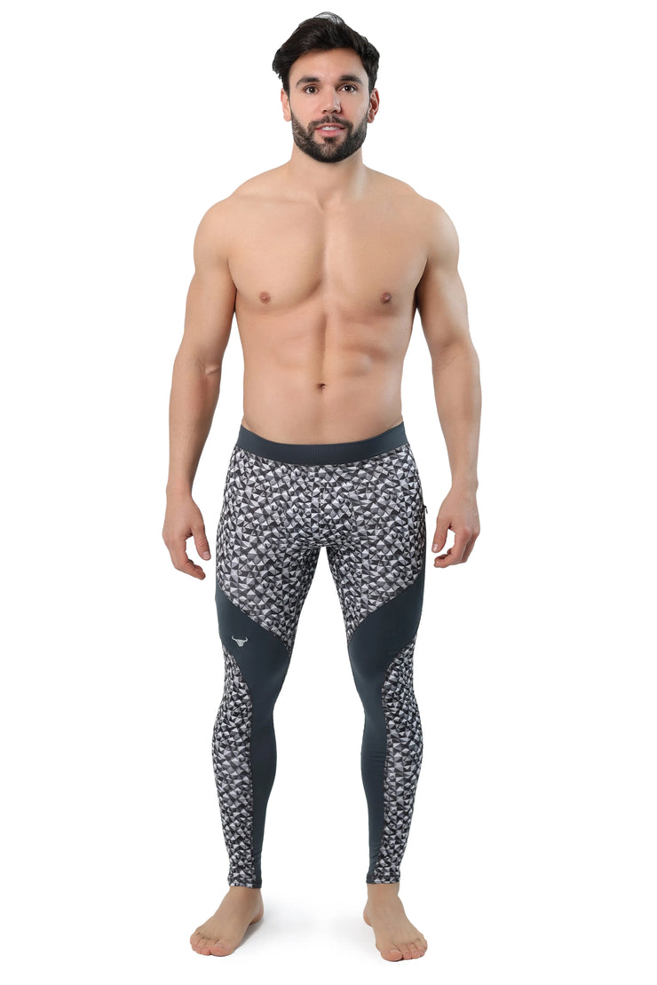 Black and grey compression leggings with abstract triangle pattern and supportive side panels.