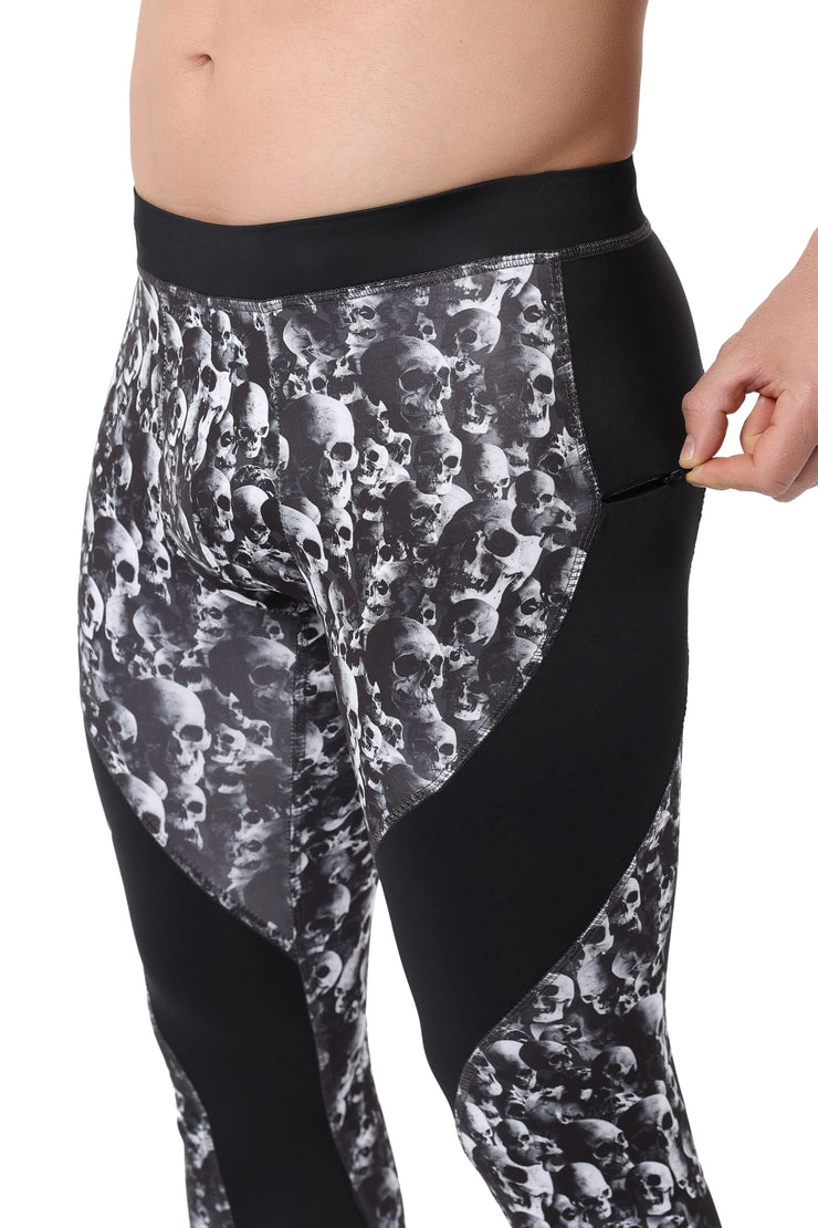 Meggings with zipper pocket featuring a black and white skull pattern and solid black side panels for a bold, edgy look.