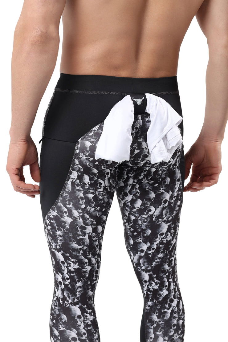 Skull leggings for men featuring black and white skull print with rear shirt loop for convenience.