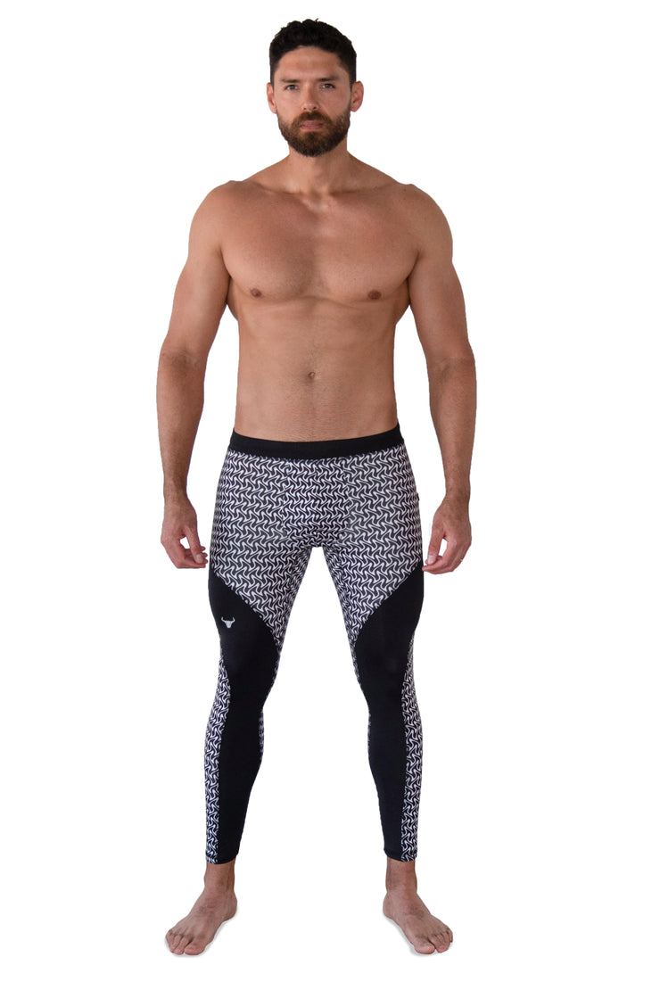 Male model wearing black and white zigzag compression pants