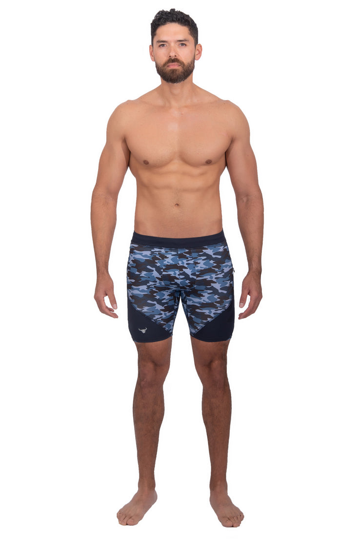 male model wearing men's compression shorts with printed blue camo design
