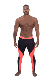 model wearing black and coral two-color men's compression leggings