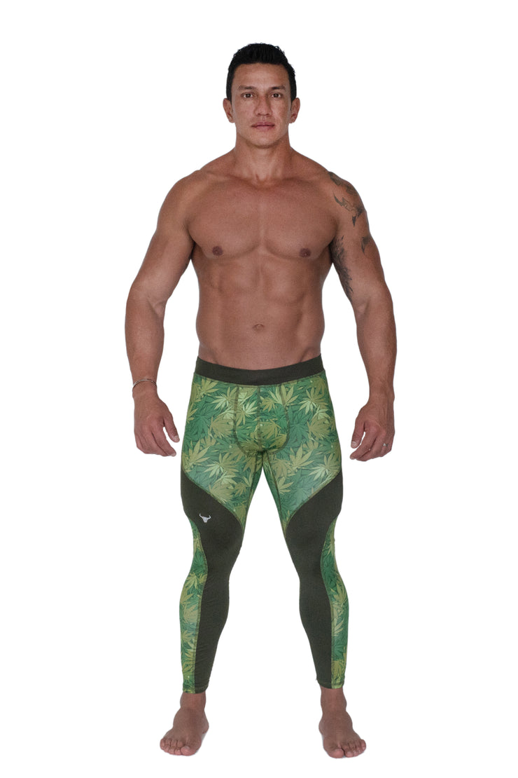 man wearing full-length workout leggings with weed leaves