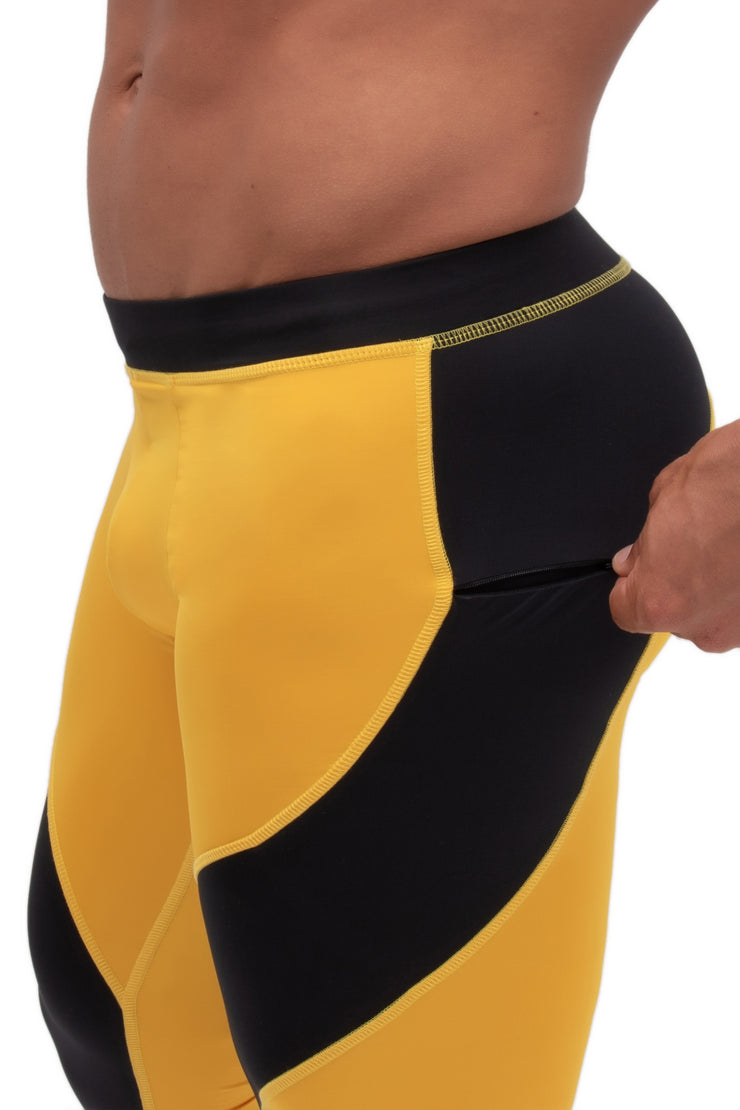 side view two color yellow and black men's leggings with secure zip pockets