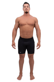 male model wearing solid black mens leggings under shorts