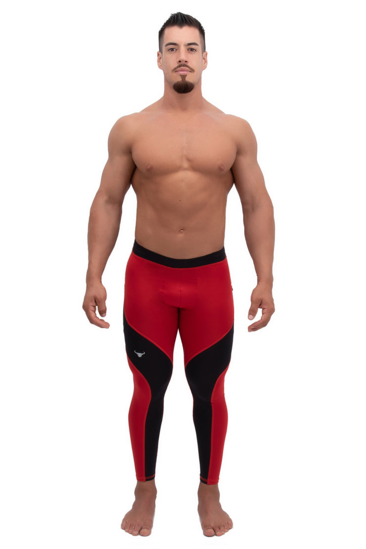 male model wearing black and red dual color full-length leggings