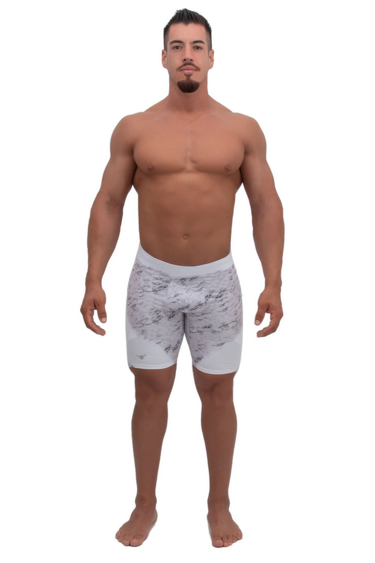 male model wearing white marble athletic shorts