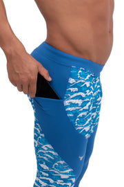 side view of blue tsunami compression pants for men with phone pocket
