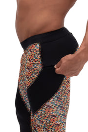 Men's soft compression pants with printed patchwork design and secure zip pocket