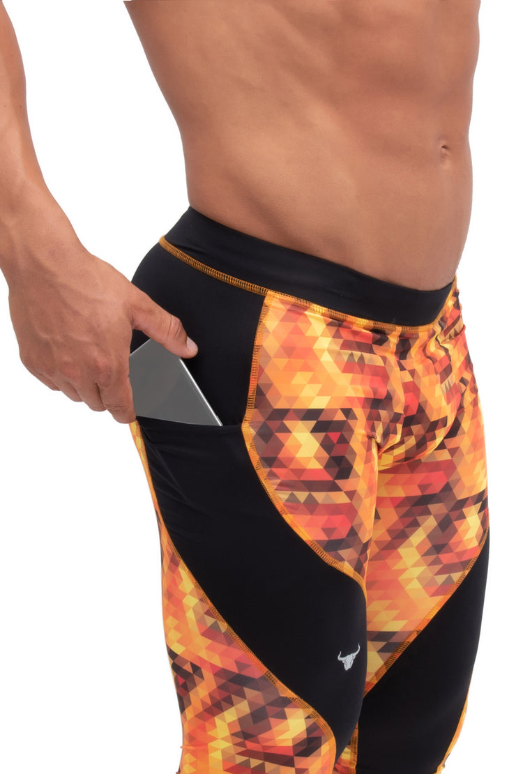 Side view of men's orange starburst compression tights with pockets