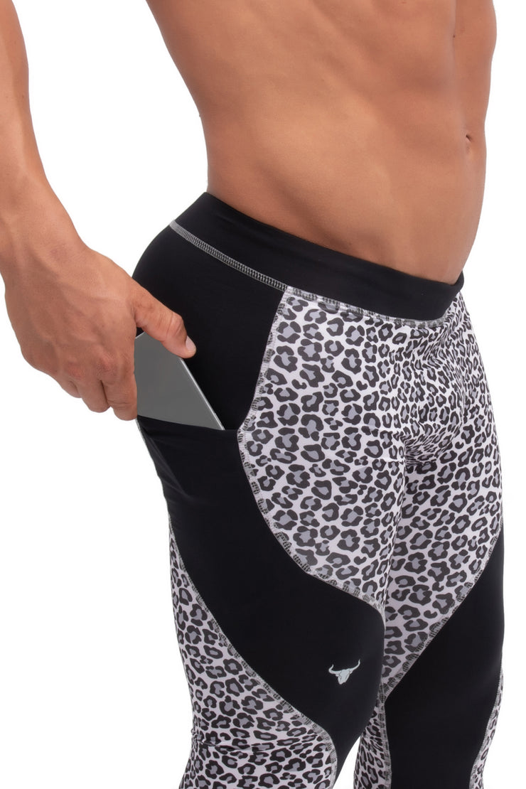 Side view of animal print snow leopard men's compression pants with phone pockets