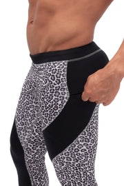 side view of black and white snow leopard leggings with secure zip pocket